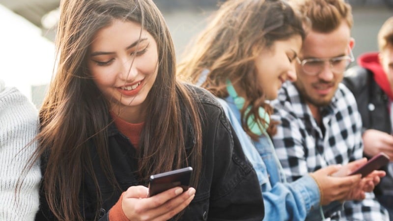 Young people with phones
