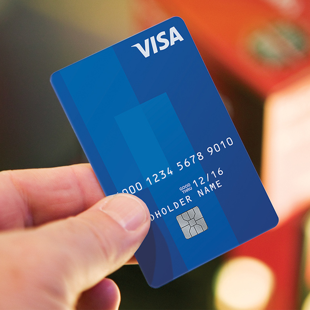 Man holding Visa card. Man holding Visa card.
