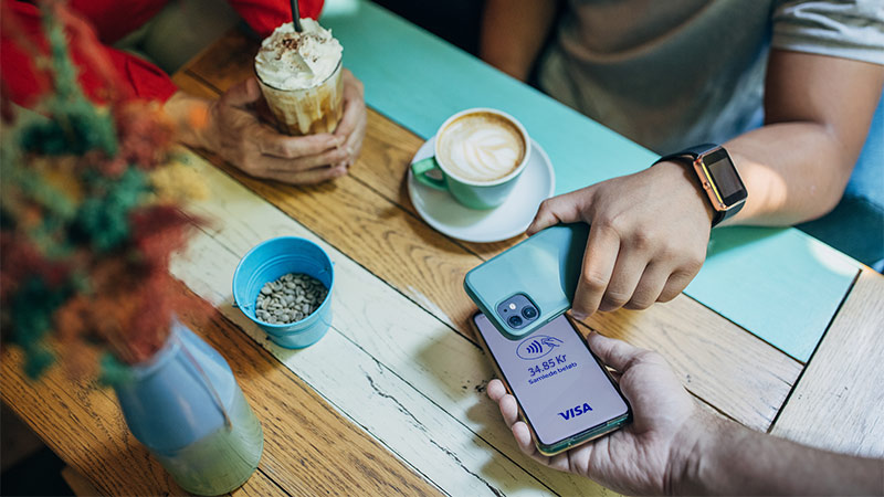contactless phone payment in coffee shop