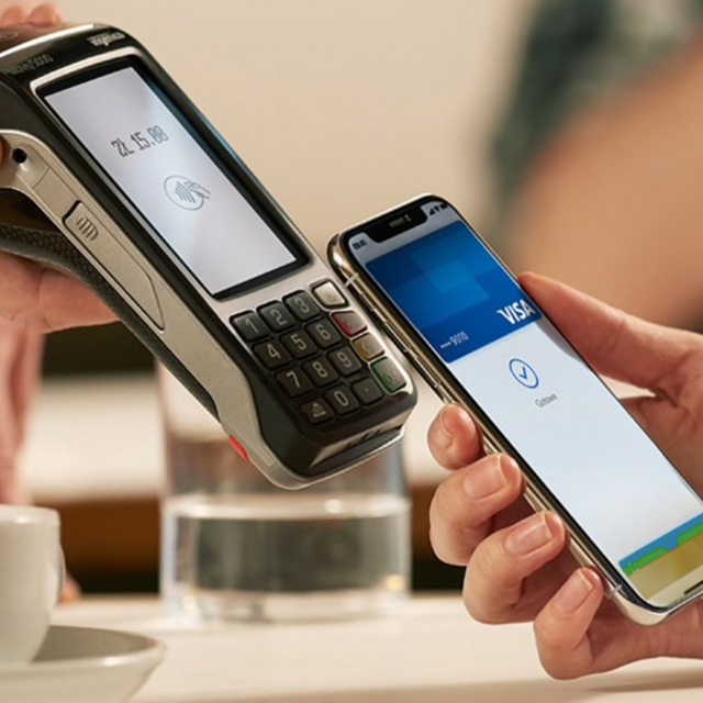 Using Apple Pay at a contactless-enabled terminal inside a taxi.